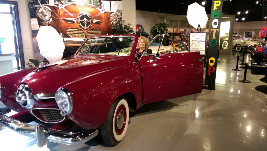 Caption: Visitors to the Studebaker National Museum can step back in time by posing at the wheel of this 1950 Studebaker “Bullet Nose.”